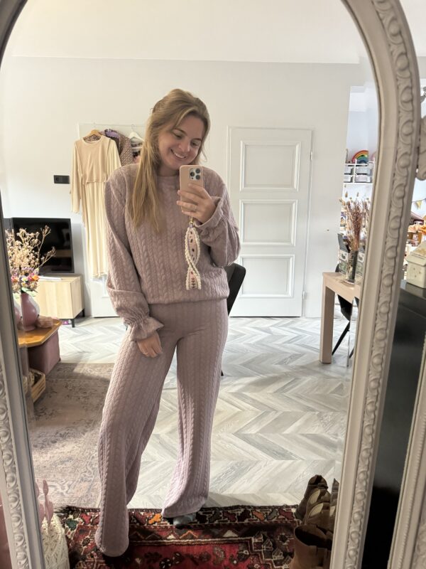 Old pink knitted cable suit